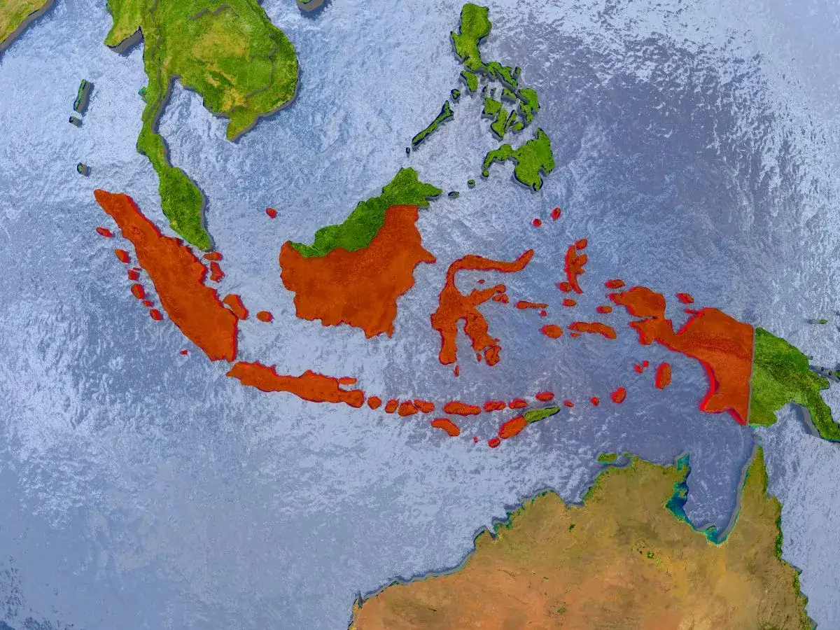 Mapa świata z zaznaczoną Indonezją. Widzimy archipelag wysp, który odpowiada na pytanie, gdzie leży Indonezja, między Azją a Australią.